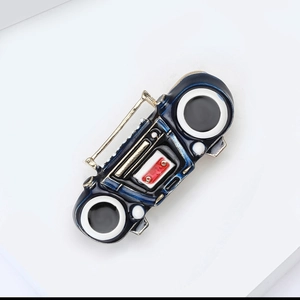 Macro shot of retro boombox alloy brooch featuring detailed 80s blue enamel design
