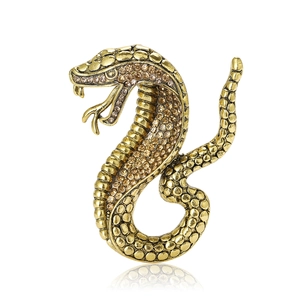 Vintage cobra snake brooch with rhinestones in antique gold finish for suit lapels