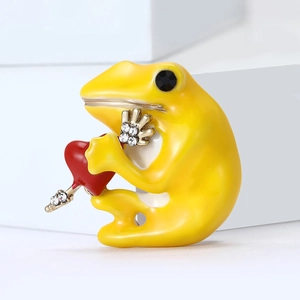Creative yellow frog brooch with red heart pendant and sparkling rhinestone accents