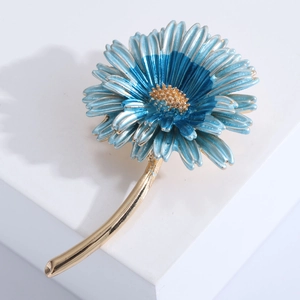 Elegant blue daisy brooch with multilayer petals and gold flower stem in a modern design