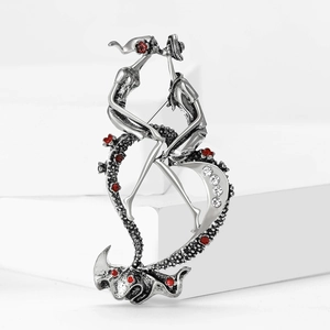 Vintage silver couple brooch featuring an enamel red flower and sparkling rhinestones