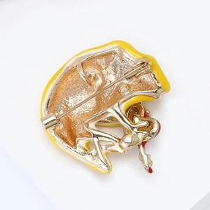 Detailed back view of enamel brooch showing the gold-plated safety pin and secure locking clasp