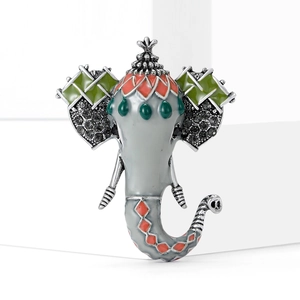 Exquisite elephant brooch with grey enamel and rhinestones on a white geometric stand