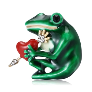 Creative frog holding a red heart brooch with green enamel and sparkling rhinestones