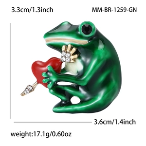 Green frog enamel brooch holding a red heart with sparkling rhinestone accents