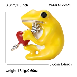 Enamel yellow frog brooch holding a red heart with sparkling rhinestone accents