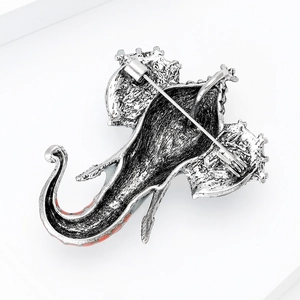 Detailed back view of vintage silver elephant brooch with safety pin fastener