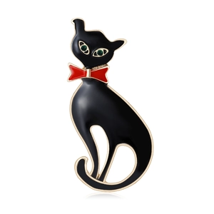 Broche chat élégante en émail noir avec nœud rouge et yeux en pierres précieuses vertes