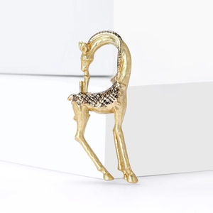 Artistic gold giraffe brooch with black enamel spots on white geometric cubes