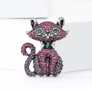 Sparkling purple cat brooch with rhinestones on vintage silver base in a sitting pose