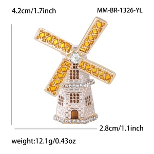Detail view of enamel windmill brooch with dimensions 4.2cm by 2.8cm and crystal accents
