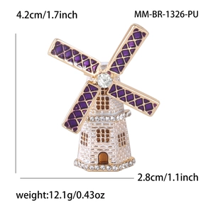 Detailed view of enamel windmill brooch with purple petals and rhinestone center