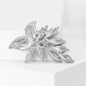 Elegant floral rhinestone brooch in silver alloy with secure pin fastening back view