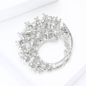 Detailed back view of silver alloy flower brooch showing metal texture and pin fastening