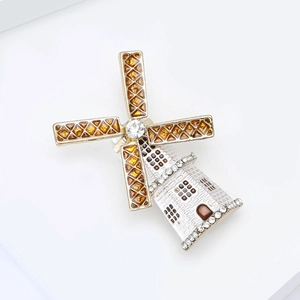 Detail of Dutch windmill brooch with enamel filling and crystal inlay craftsmanship
