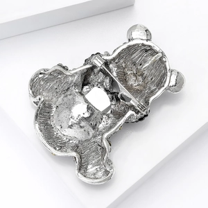 Silver bear brooch back view showing textured metal finish and safety rotary pin lock