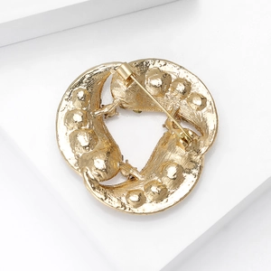 Elegant gold vintage wreath brooch with pearl-like texture and secure safety pin