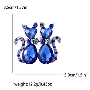 Dark green crystal cat brooch with bow tie and sparkling blue rhinestones for women