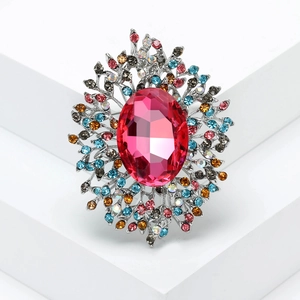 Luxury silver-tone brooch with large oval magenta crystal and colorful rhinestones