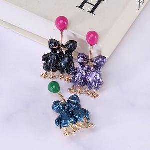 Enamel balloon couple duck brooches in various colors on marble background