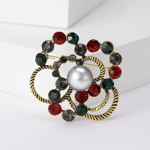 Retro round brooch with large silver pearl, vintage gold twist, and colorful rhinestones