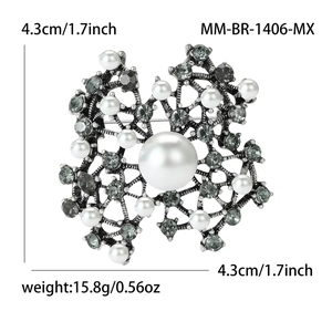 Vintage silver-tone snowflake brooch with white pearls and grey crystals, 4.3cm size