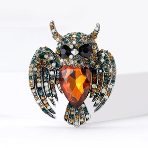 Vintage winged owl brooch with amber heart crystal and multicolor rhinestones