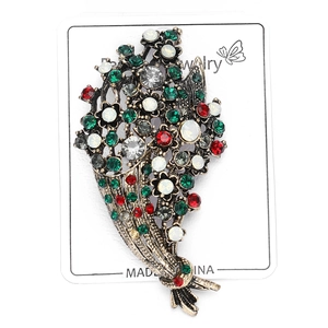 Detail shot of vintage bouquet brooch with multi-colored rhinestones and antique metal base