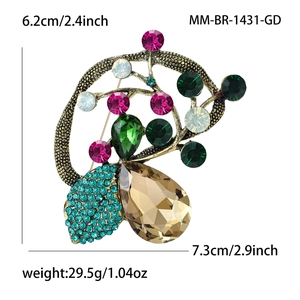 Macro view of vintage gold brooch with colorful crystals and size measurements