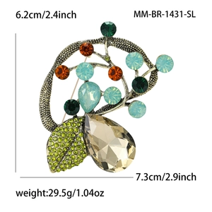 Detail view of a vintage floral brooch with crystals and precise dimensions of 7.3cm x 6.2cm