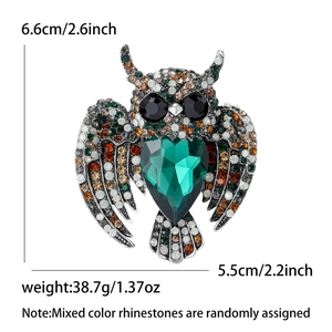 Vintage owl brooch with colorful crystals and heart-shaped green stone, 6.6cm x 5.5cm size