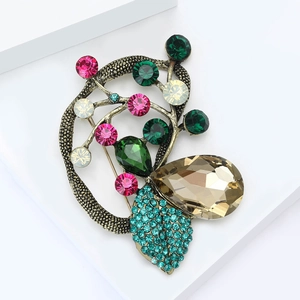 Baroque vintage brooch with multicolor crystals and teardrop gemstone in antique gold finish