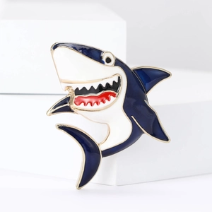 Cute cartoon shark enamel brooch pin with blue alloy finish on white pedestal