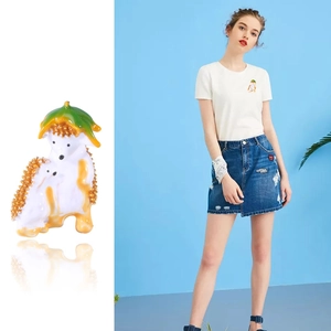 Cute enamel hedgehog family brooch set with orange texture and green leaf accents