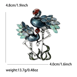 Detailed size view of a vintage flamingo brooch featuring enamel and crystals