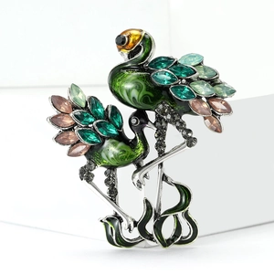Elegant vintage twin cranes brooch with green crystals and silver alloy finish