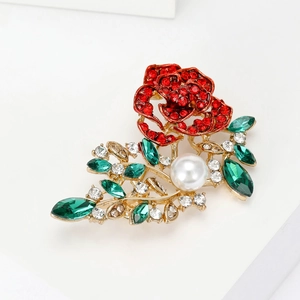Elegant rose crystal brooch with red rhinestones, green leaves and a white pearl accent