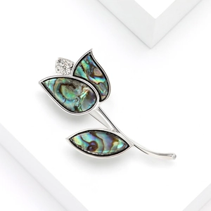 Elegant tulip brooch with colorful shell inlay and small diamonds on silver metal base