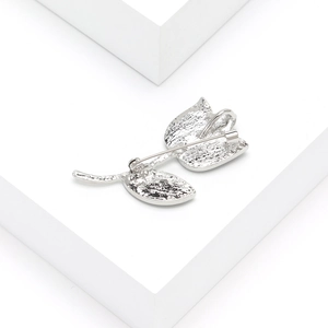 Vintage tulip brooch in silver metal featuring shell inlay and detailed back clasp texture