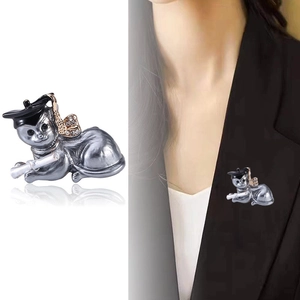 Cartoon dog brooch with graduation cap and sparkling rhinestones on suit jacket