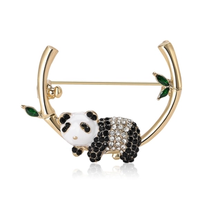 Cute panda brooch with black and white rhinestones on golden bamboo branch with green leaves
