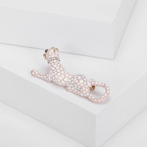 Elegant white enamel leopard brooch with green gemstone eyes and sparkling crystal collar