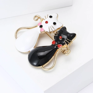 Broches de chats en alliage émaillé noir et blanc avec strass brillants pour les vestes