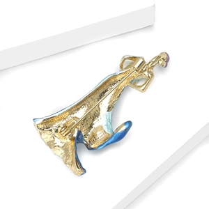 Detailed close-up of an elegant folding fan lady brooch with colorful enamel glaze