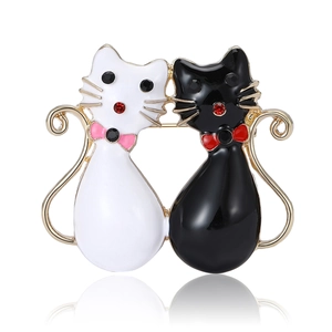 Ensemble de broches chats en émail noir et blanc avec finition dorée pour femme