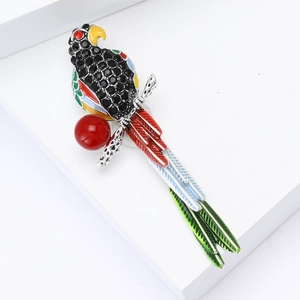 Broche perroquet exquise avec ailes en émail coloré et strass noirs sur bloc blanc
