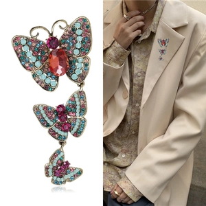 Vintage butterfly brooch with three layered wings and colorful rhinestones for women