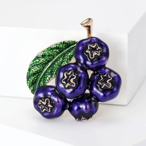 Creative blueberry fruit brooch with five indigo berries and a green leaf in gold alloy