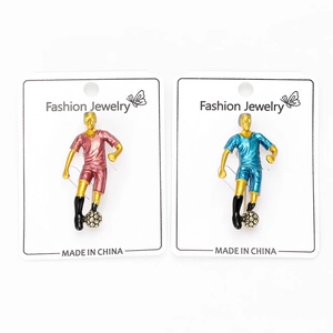 Detail of soccer player pins in red and blue uniforms on a Fashion Jewelry card