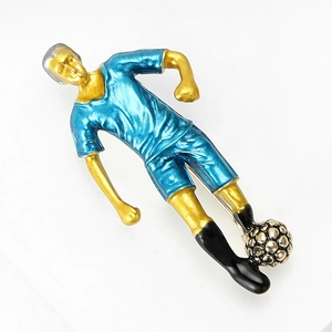 Detailed close-up of a dynamic football player brooch in blue and gold enamel